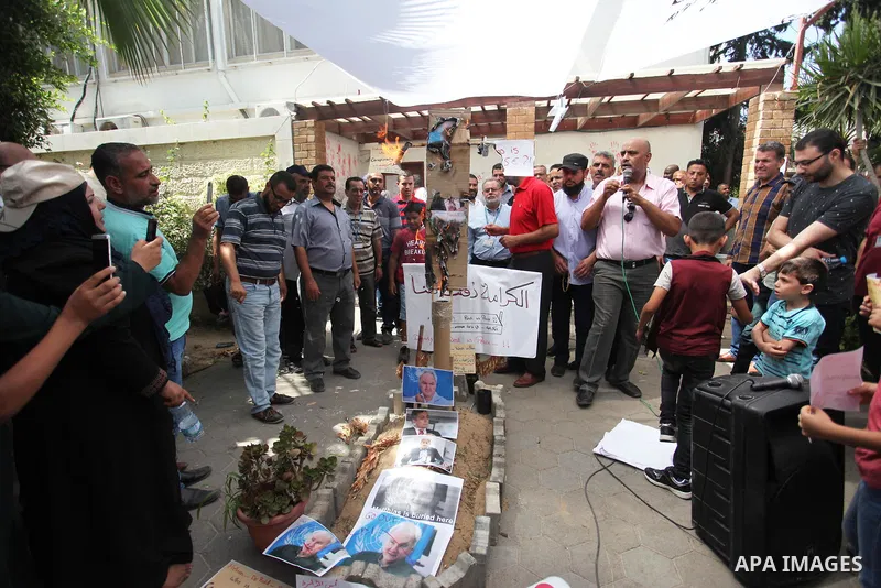 Palestinian employees of United Nations Relief and Works Agency (UNRWA) take part in a protest against jobs termination by UNRWA inside its headquarters in Gaza City, on July 26, 2018. Photo by Mahmoud Ajour