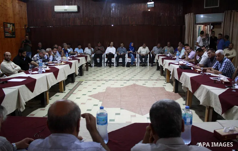 Palestinian faction members attend a meeting in Gaza city, on July 26, 2018. Photo by Bashar Zakri
