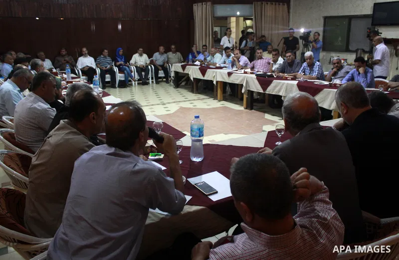 Palestinian faction members attend a meeting in Gaza city, on July 26, 2018. Photo by Bashar Zakri