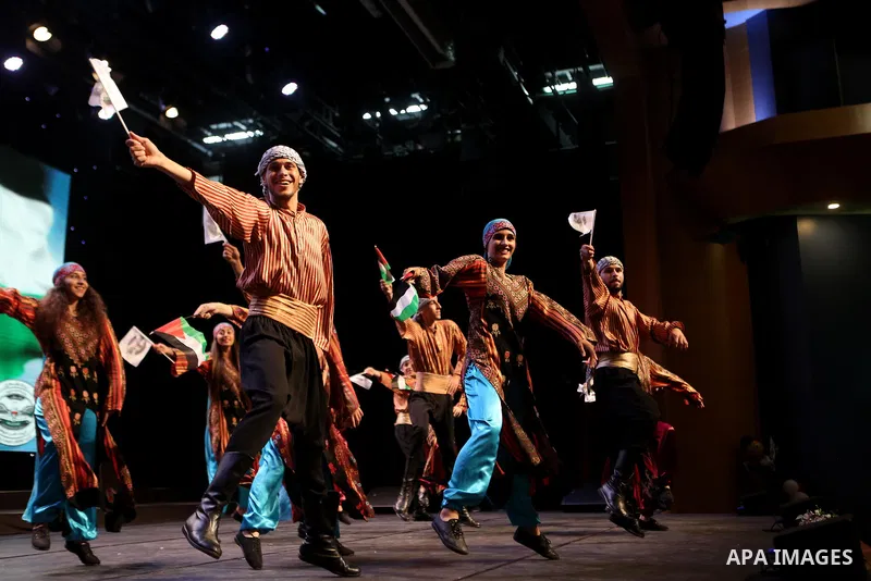 Palestinian Asayel band of folk art, perform during a show on the stage in the West Bank city of Ramallah, on June 26, 2018. Photo by Shadi Hatem