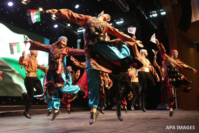 Palestinian Asayel band of folk art, perform during a show on the stage in the West Bank city of Ramallah, on June 26, 2018. Photo by Shadi Hatem