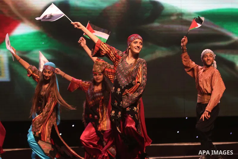 Palestinian Asayel band of folk art, perform during a show on the stage in the West Bank city of Ramallah, on June 26, 2018. Photo by Shadi Hatem