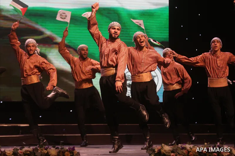 Palestinian Asayel band of folk art, perform during a show on the stage in the West Bank city of Ramallah, on June 26, 2018. Photo by Shadi Hatem