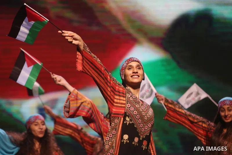 Palestinian Asayel band of folk art, perform during a show on the stage in the West Bank city of Ramallah, on June 26, 2018. Photo by Shadi Hatem