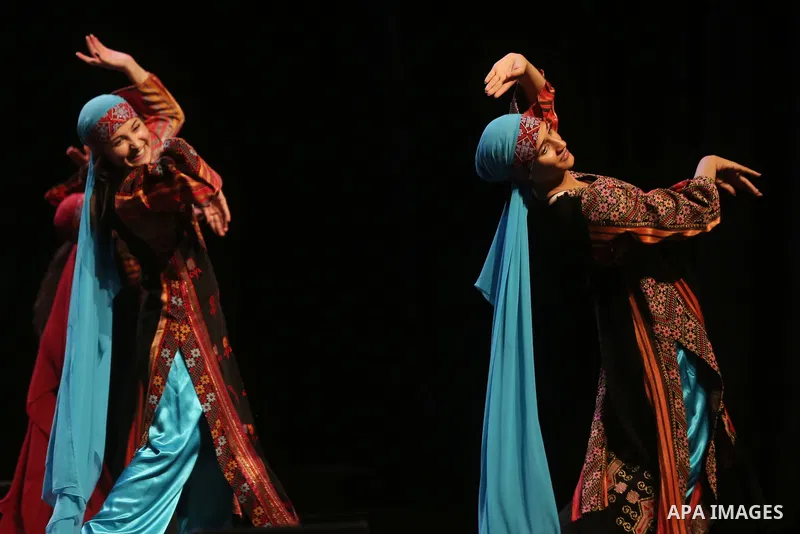 Palestinian Asayel band of folk art, perform during a show on the stage in the West Bank city of Ramallah, on June 26, 2018. Photo by Shadi Hatem