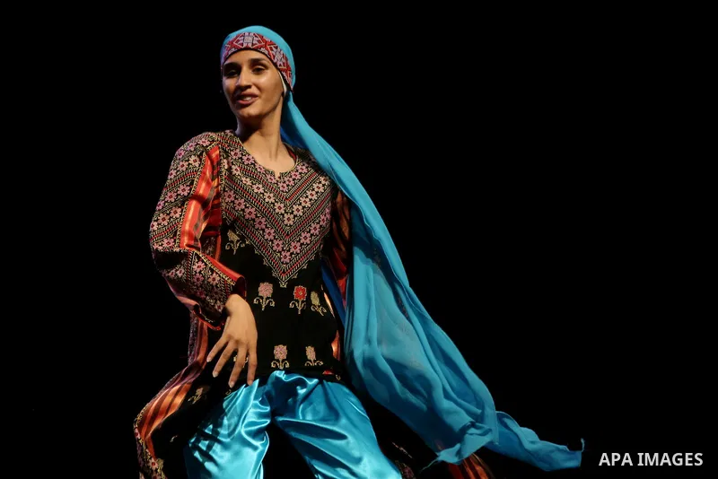 Palestinian Asayel band of folk art, perform during a show on the stage in the West Bank city of Ramallah, on June 26, 2018. Photo by Shadi Hatem