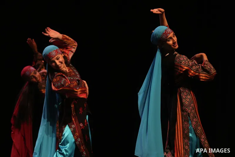 Palestinian Asayel band of folk art, perform during a show on the stage in the West Bank city of Ramallah, on June 26, 2018. Photo by Shadi Hatem