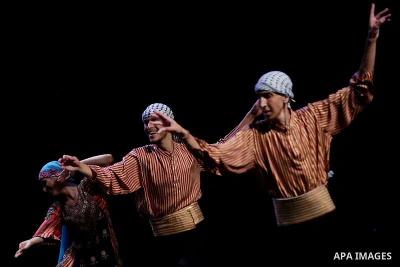 Palestinian Asayel band of folk art, perform during a show on the stage in the West Bank city of Ramallah, on June 26, 2018. Photo by Shadi Hatem