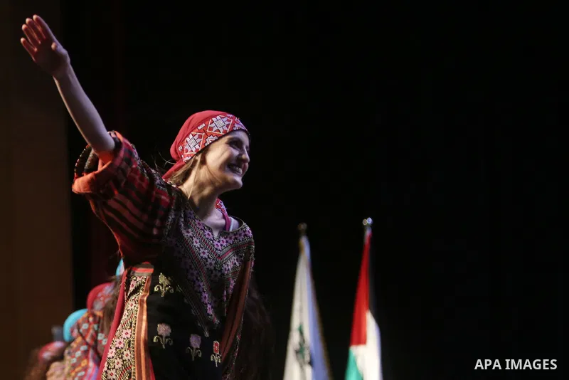 Palestinian Asayel band of folk art, perform during a show on the stage in the West Bank city of Ramallah, on June 26, 2018. Photo by Shadi Hatem