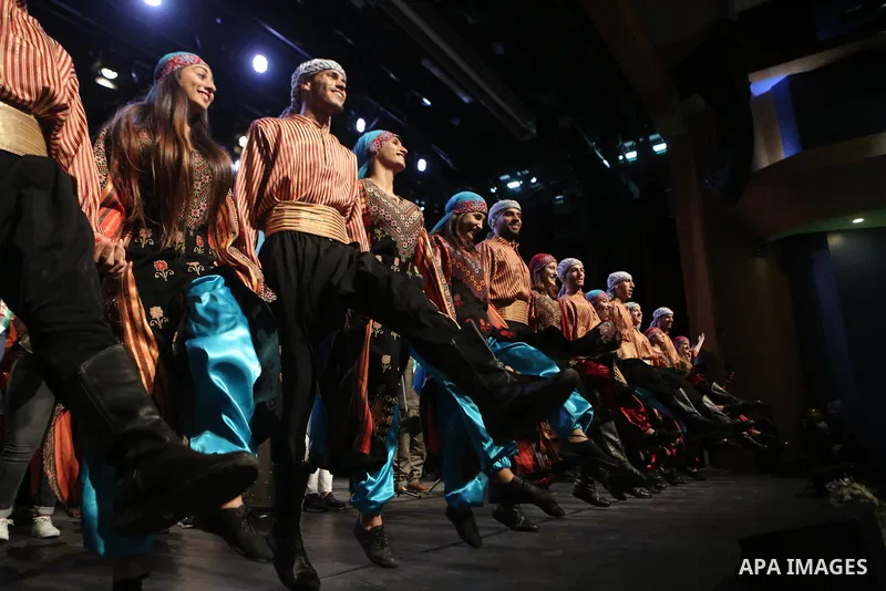 Palestinian Asayel band of folk art, perform during a show on the stage in the West Bank city of Ramallah, on June 26, 2018. Photo by Shadi Hatem