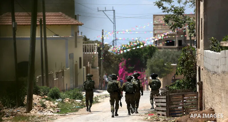 Israeli security forces take position during clashes with Palestinian protesters following a demonstration against the expropriation of Palestinian land by Israel in the village of Kfar Qaddum, near Nablus, in the occupi...