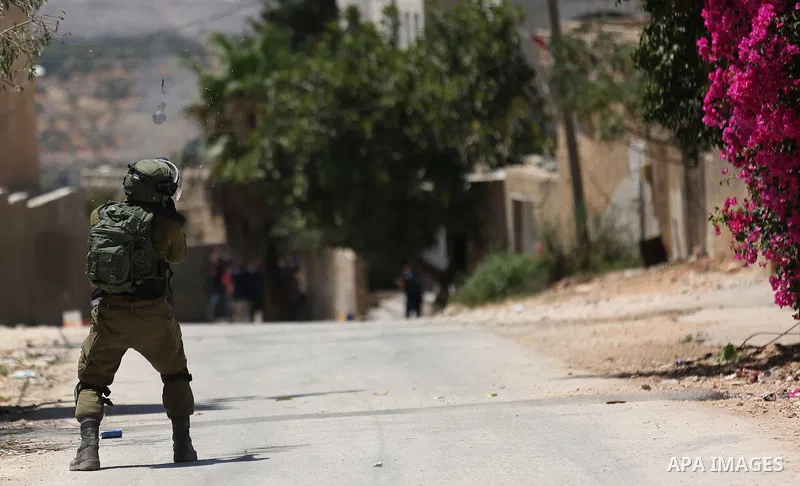 Israeli security forces take position during clashes with Palestinian protesters following a demonstration against the expropriation of Palestinian land by Israel in the village of Kfar Qaddum, near Nablus, in the occupi...