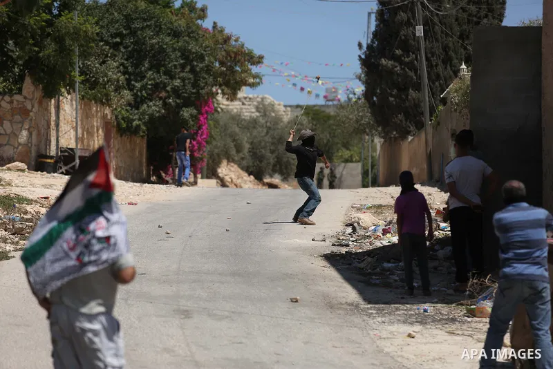 Palestinian protesters gather during clashes with Israeli troops following a demonstration against the expropriation of Palestinian land by Israel in the village of Kfar Qaddum, near Nablus, in the occupied West Bank on...