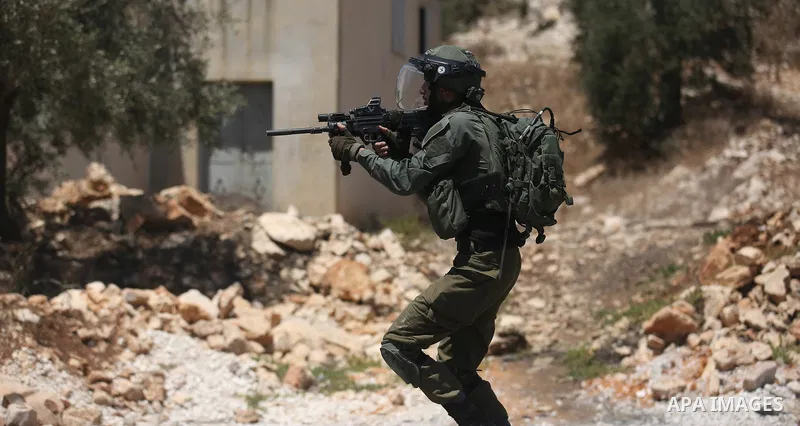 Israeli security forces take position during clashes with Palestinian protesters following a demonstration against the expropriation of Palestinian land by Israel in the village of Kfar Qaddum, near Nablus, in the occupi...