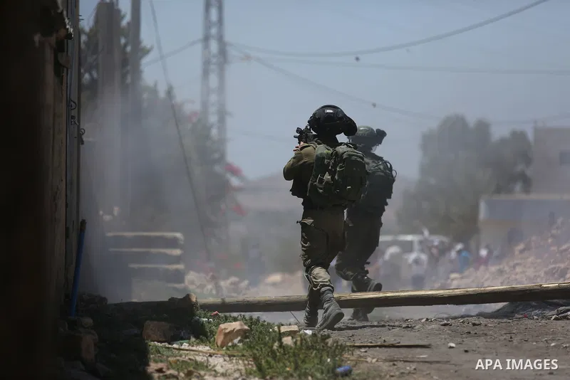 Israeli security forces take position during clashes with Palestinian protesters following a demonstration against the expropriation of Palestinian land by Israel in the village of Kfar Qaddum, near Nablus, in the occupi...