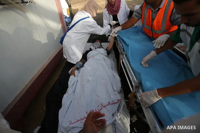 Palestinian protesters gather during clashes with Israeli troops in tents protest where Palestinian demand the right to return to their homeland at the Israel-Gaza border, in Khan Younis, in the southern Gaza Strip on Ju...