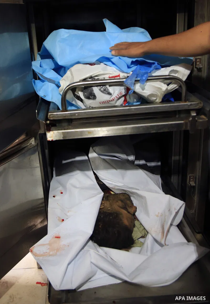 The bodies of Palestinian, who were killed in an unexplained explosion are seen at Indonesian hospital, in the northern of Gaza Strip on July 29, 2018. Photo by Dawoud Abo Alkas
