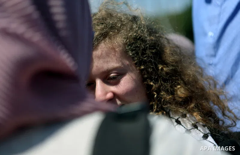 Palestinian activist Ahed Tamimi arrives at the mausoleum of former Palestinian leader Yasser Arafat in the West Bank city of Ramallah, on July 29, 2018, after she was released from prison earlier in the day following an...