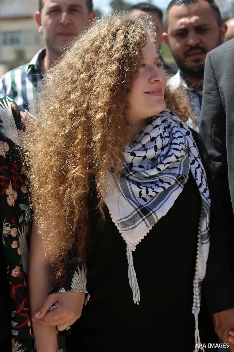 Palestinian activist Ahed Tamimi arrives at the mausoleum of former Palestinian leader Yasser Arafat in the West Bank city of Ramallah, on July 29, 2018, after she was released from prison earlier in the day following an...
