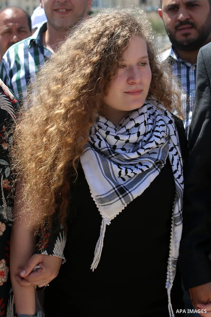 Palestinian activist Ahed Tamimi arrives at the mausoleum of former Palestinian leader Yasser Arafat in the West Bank city of Ramallah, on July 29, 2018, after she was released from prison earlier in the day following an...