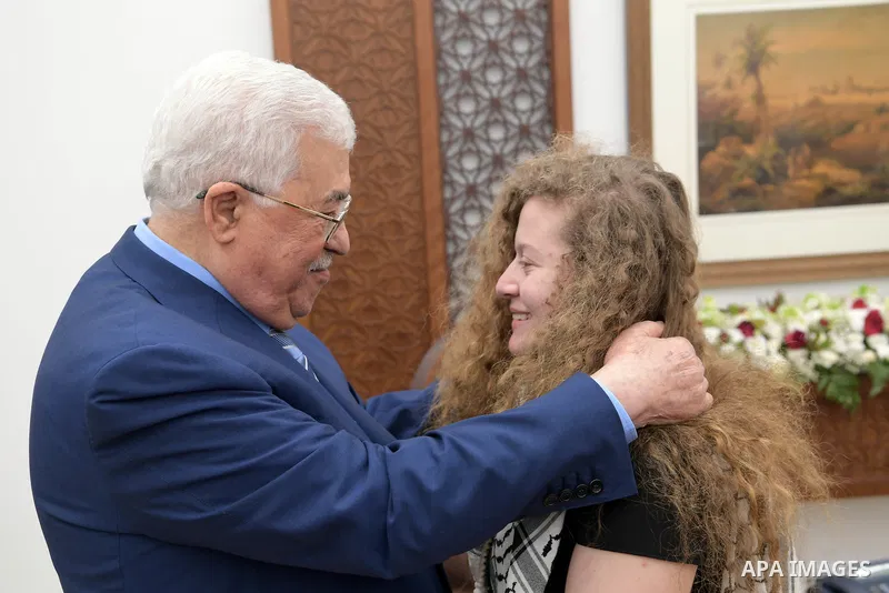 Palestinian President Mahmoud Abbas meets with Palestinian activist Ahed Tamimi, in the West Bank city of Ramallah, on July 29, 2018. Photo by Thaer Ganaim