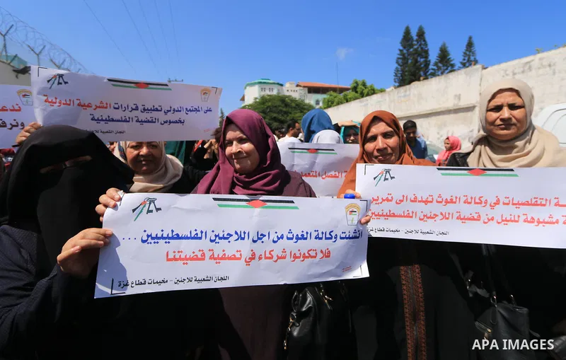 Palestinian employees of United Nations Relief and Works Agency (UNRWA) take part in a protest against job cuts announced by the agency outside its offices in Gaza City on July 29, 2018. Photo by Mahmoud Khattab