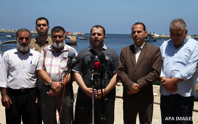 Spokesman of the National Commission to break the siege Adham Abu Salmiya, speaks during a press conference at the seaport in Gaza city on July 29, 2018. Photo by Mahmoud Ajour