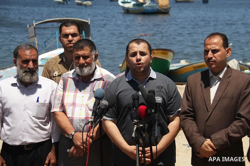 Spokesman of the National Commission to break the siege Adham Abu Salmiya, speaks during a press conference at the seaport in Gaza city on July 29, 2018. Photo by Mahmoud Ajour