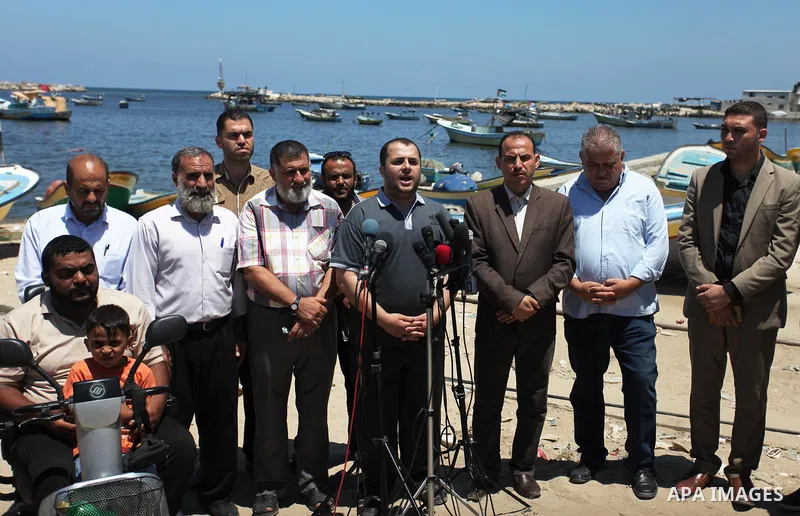 Spokesman of the National Commission to break the siege Adham Abu Salmiya, speaks during a press conference at the seaport in Gaza city on July 29, 2018. Photo by Mahmoud Ajour