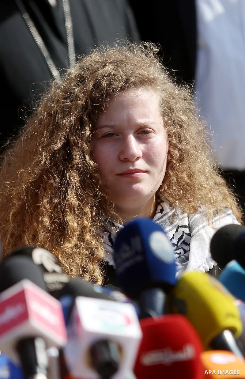 Palestinian activist and campaigner Ahed Tamimi holds a press conference in the West Bank village of Nabi Saleh near Ramallah on July 29, 2018, upon her release from prison after an eight-month sentence for slapping two...