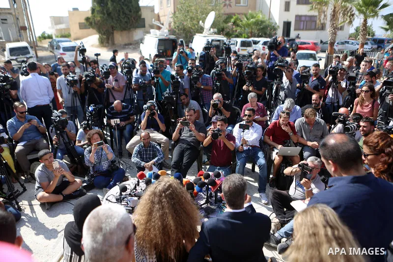 Palestinian activist and campaigner Ahed Tamimi and her mother hold a press conference in the West Bank village of Nabi Saleh near Ramallah on July 29, 2018, upon her release from prison after an eight-month sentence for...