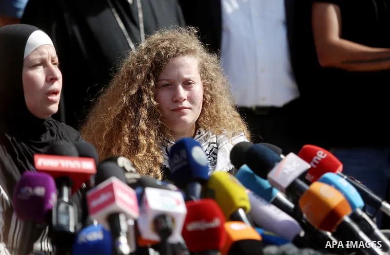 Palestinian activist and campaigner Ahed Tamimi and her mother hold a press conference in the West Bank village of Nabi Saleh near Ramallah on July 29, 2018, upon her release from prison after an eight-month sentence for...