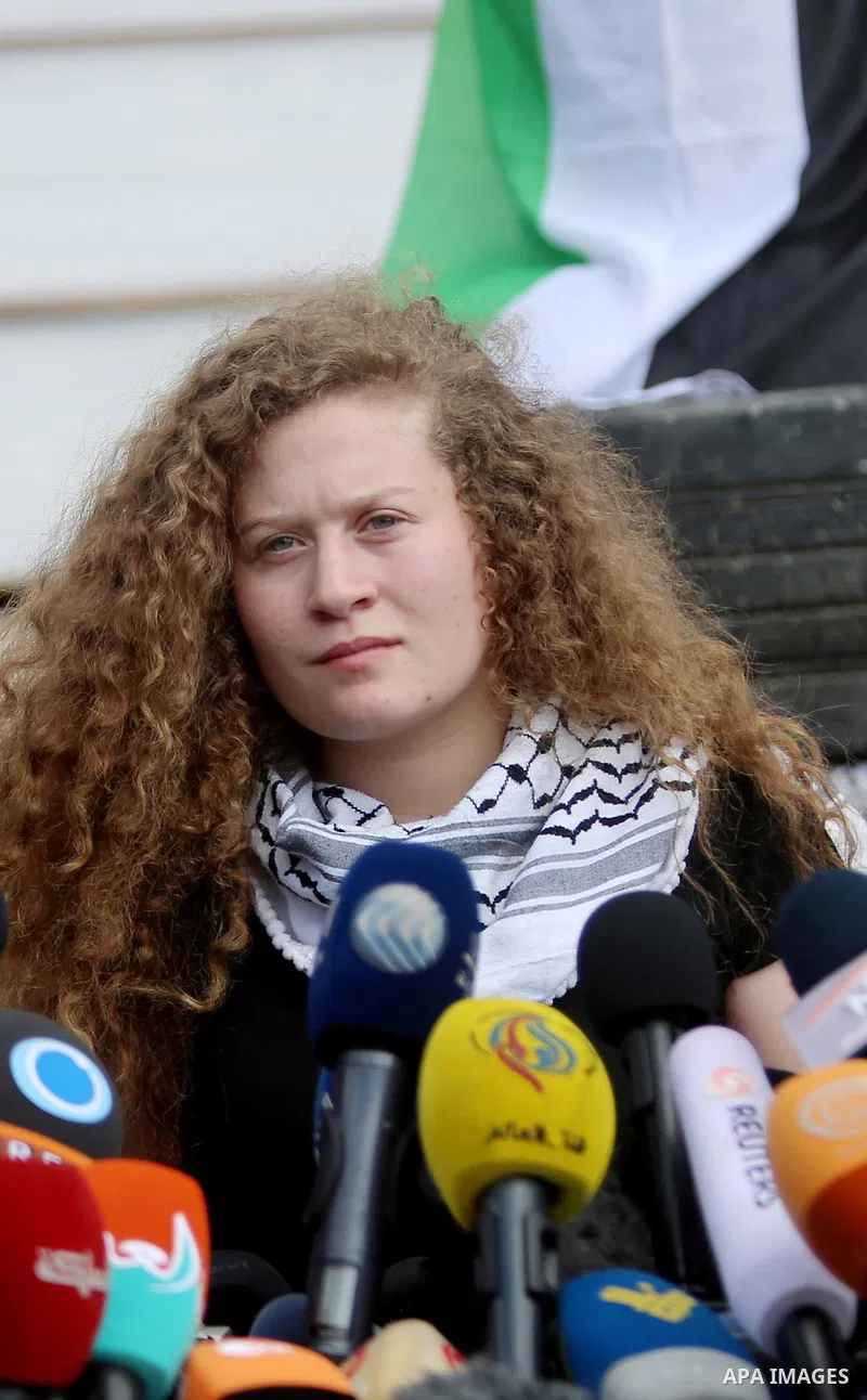 Palestinian activist and campaigner Ahed Tamimi holds a press conference in the West Bank village of Nabi Saleh near Ramallah on July 29, 2018, upon her release from prison after an eight-month sentence for slapping two...