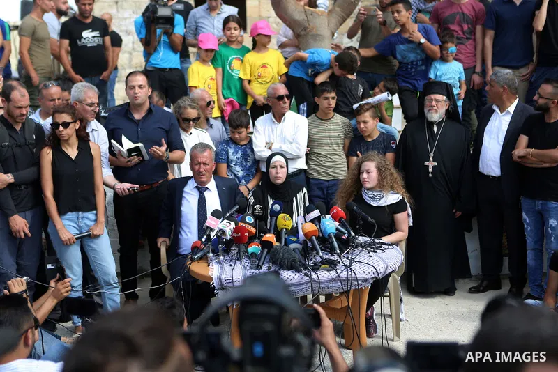 Palestinian activist and campaigner Ahed Tamimi and her mother hold a press conference in the West Bank village of Nabi Saleh near Ramallah on July 29, 2018, upon her release from prison after an eight-month sentence for...