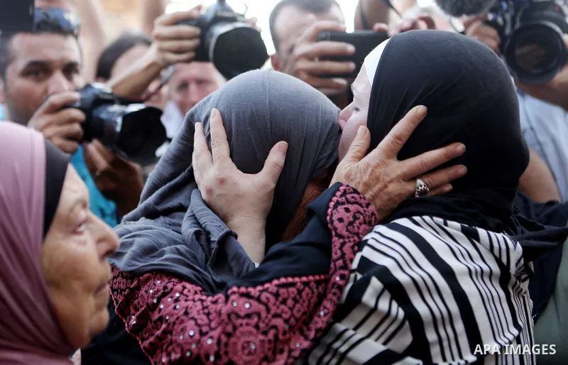 Palestinian activist and campaigner Ahed Tamimi and her mother are welcomed by friends and relatives in the West Bank village of Nabi Saleh near Ramallah on July 29, 2018, upon her release from prison after an eight-mont...