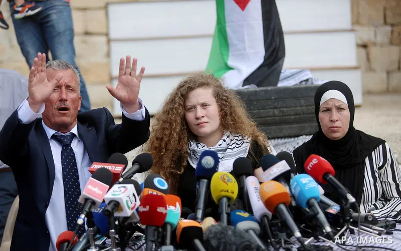 Palestinian activist and campaigner Ahed Tamimi and her mother hold a press conference in the West Bank village of Nabi Saleh near Ramallah on July 29, 2018, upon her release from prison after an eight-month sentence for...