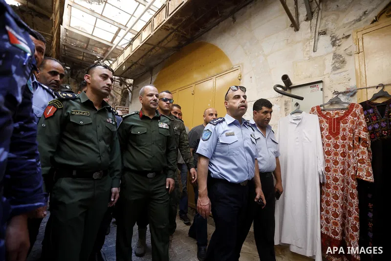 Head of the Palestinian National security forces in Hebron brigadier General Hazem Abu Hanood and head of the Palestinian police brigadier General Ahmad Abu Rob in Hebron visit the old city for the first time since 1994,...