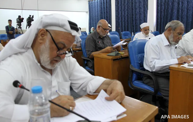 Members of the Palestinian legislative council from Hamas movement attend a meeting at the legislative council, in Gaza city, on Aug. 01, 2018. Photo by Mahmoud Ajour