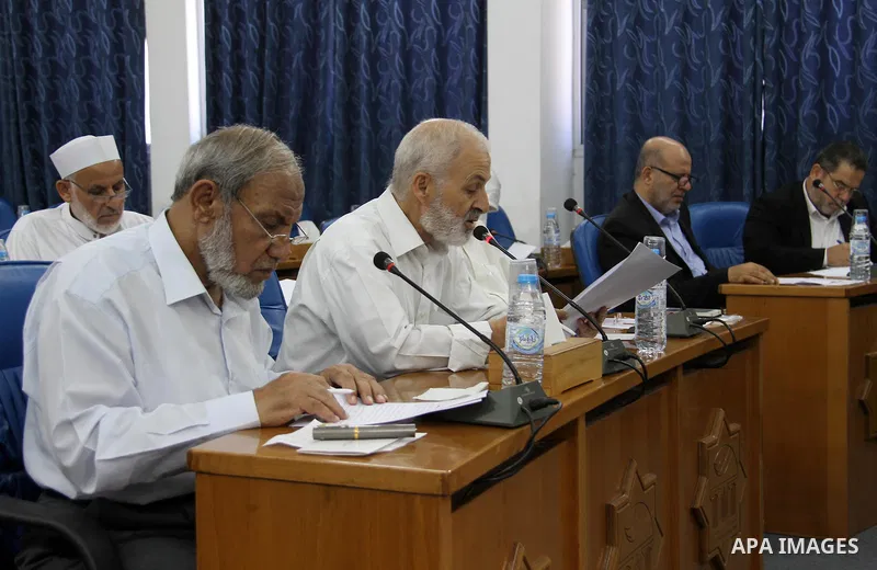 Members of the Palestinian legislative council from Hamas movement attend a meeting at the legislative council, in Gaza city, on Aug. 01, 2018. Photo by Mahmoud Ajour