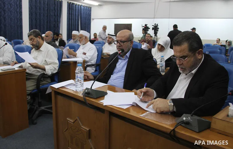 Members of the Palestinian legislative council from Hamas movement attend a meeting at the legislative council, in Gaza city, on Aug. 01, 2018. Photo by Mahmoud Ajour