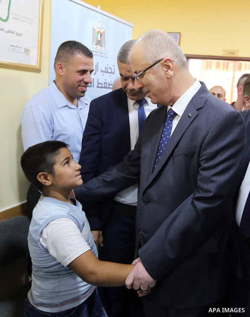 Palestinian Prime Minister Rami Hamdallah opens departments in Hebron hospitals, in the West Bank city of Hebron, on Aug. 01, 2018. Photo by Prime Minister Office