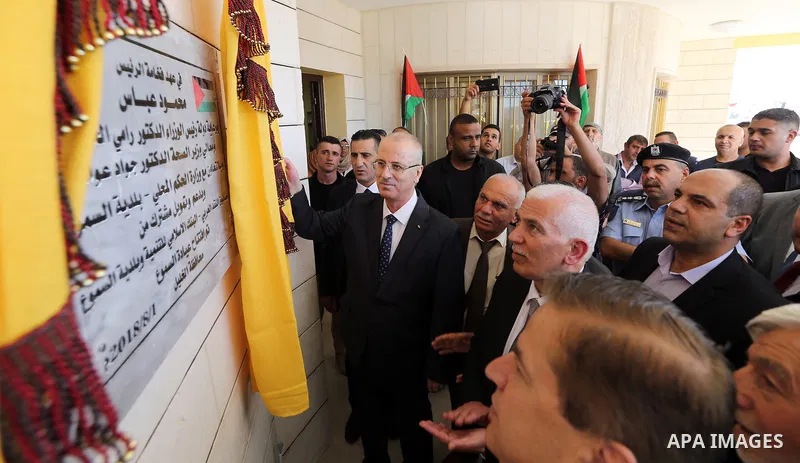 Palestinian Prime Minister Rami Hamdallah opens departments in Hebron hospitals, in the West Bank city of Hebron, on Aug. 01, 2018. Photo by Prime Minister Office