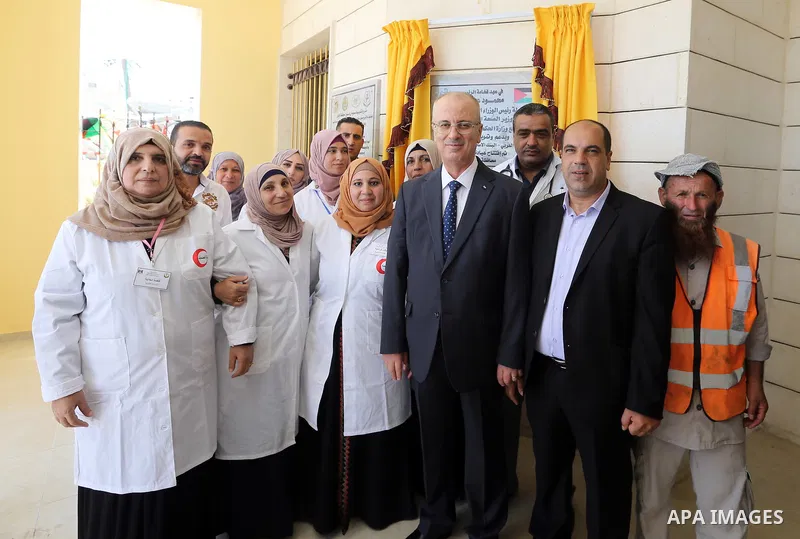 Palestinian Prime Minister Rami Hamdallah opens departments in Hebron hospitals, in the West Bank city of Hebron, on Aug. 01, 2018. Photo by Prime Minister Office
