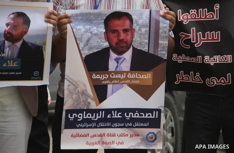 Palestinian journalists take part in a protest against the decision of the Israeli occupation to block work in Al-Quds TV in Jerusalem and West Bank, in front of the Red cross office, in Gaza city, on Aug. 02 2018. Photo...
