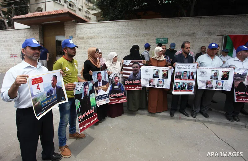 Palestinian journalists take part in a protest against the decision of the Israeli occupation to block work in Al-Quds TV in Jerusalem and West Bank, in front of the Red cross office, in Gaza city, on Aug. 02 2018. Photo...