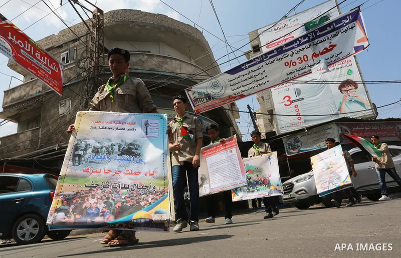 Palestinian scouts take part in a march "The Great Return March", in Rafah in the southern of Gaza strip, on Aug. 02, 2018. Photo by Abed Rahim Khatib