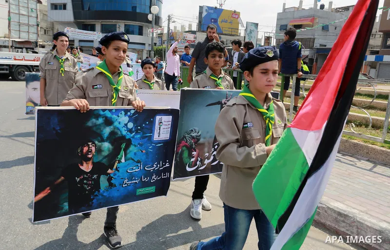 Palestinian scouts take part in a march "The Great Return March", in Rafah in the southern of Gaza strip, on Aug. 02, 2018. Photo by Abed Rahim Khatib