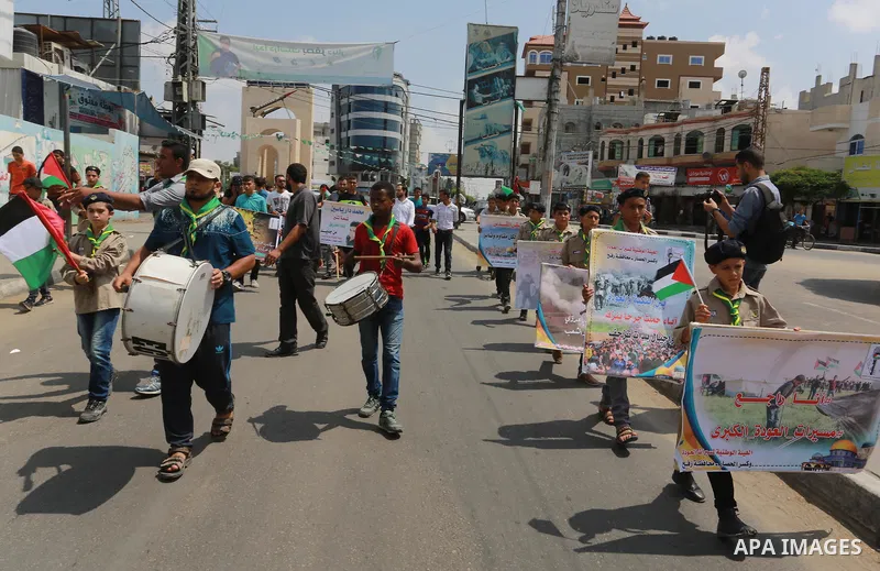 Palestinian scouts take part in a march "The Great Return March", in Rafah in the southern of Gaza strip, on Aug. 02, 2018. Photo by Abed Rahim Khatib