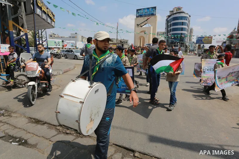 Palestinian scouts take part in a march "The Great Return March", in Rafah in the southern of Gaza strip, on Aug. 02, 2018. Photo by Abed Rahim Khatib