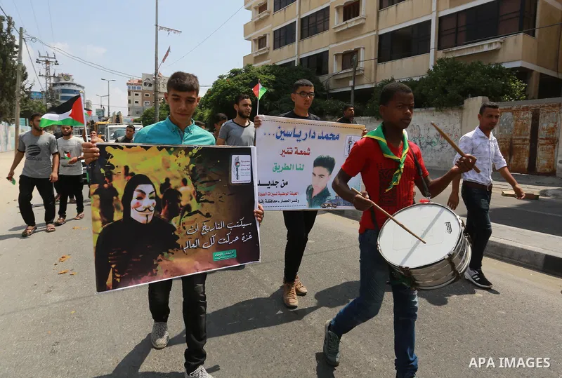 Palestinian scouts take part in a march "The Great Return March", in Rafah in the southern of Gaza strip, on Aug. 02, 2018. Photo by Abed Rahim Khatib